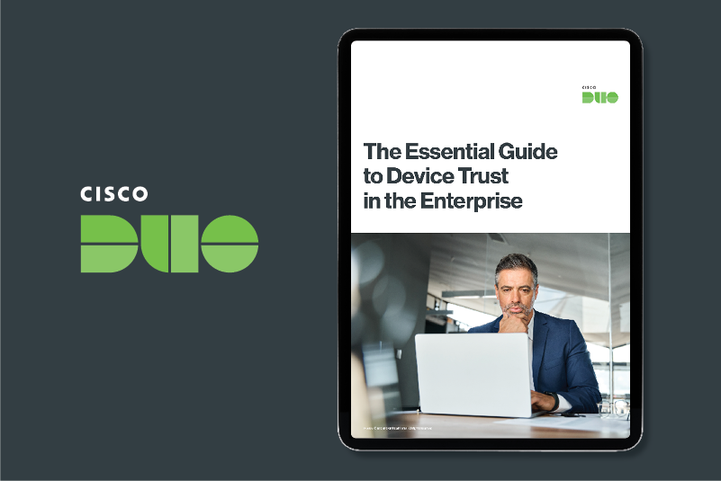 Cover image of a person in front of their laptop for the essential guide to device trust in the enterprise ebook