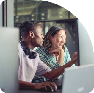 Man and lady wearing glasses looking at Laptop Screen