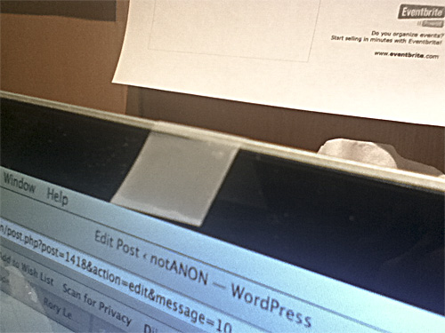 A laptop camera with tape over the camera