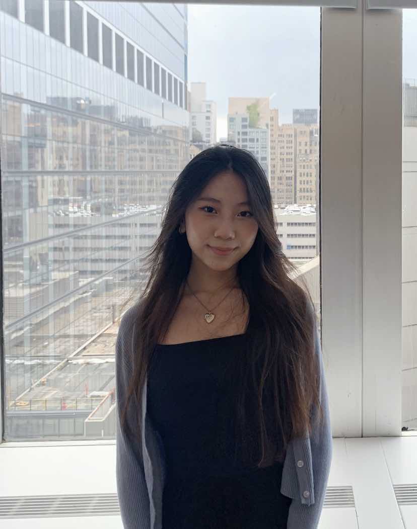 One of the interns poses in front of a window in the NYC office.