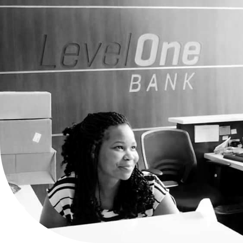 An image of a person working at Level One Bank