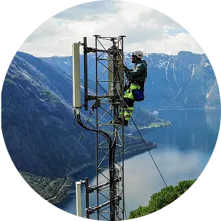 Man climbing telephone pole with many wires over head