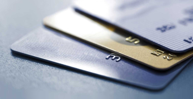 3 credit cards fanned out, representing security vulnerabilities at Point-of-Sale (POS) systems with old security solutions.