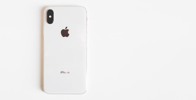 A white iPhone X lies screen-down after the Duo Labs team made a thorough investigation of FaceID.