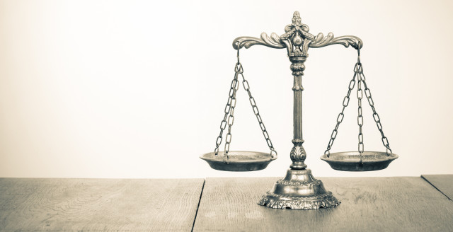 The scales of justice represent law firms in desperate need of better data security.