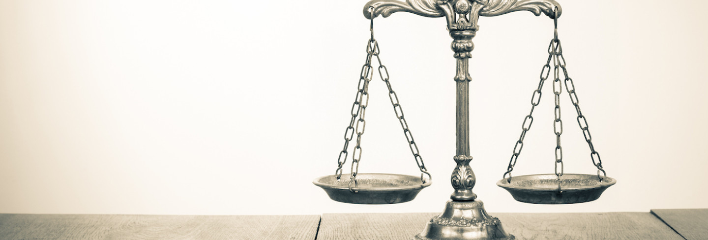 The scales of justice represent law firms in desperate need of better data security.