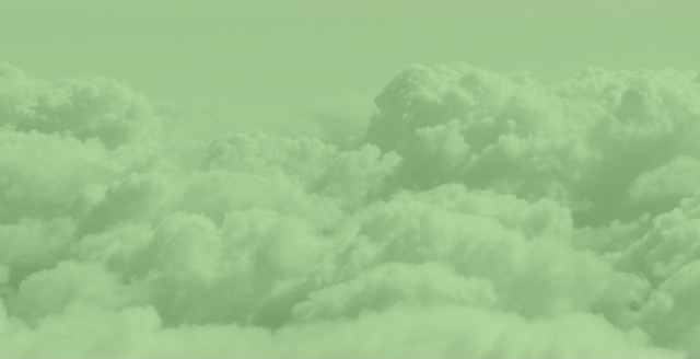 A cloudscape, overlaid with a color filter of Duo green