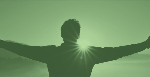Man raising his arms in success, overlaid in a color filter of Duo green