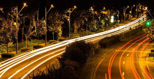 The long tail of legacy technology framed by light trails of cars on a hwy