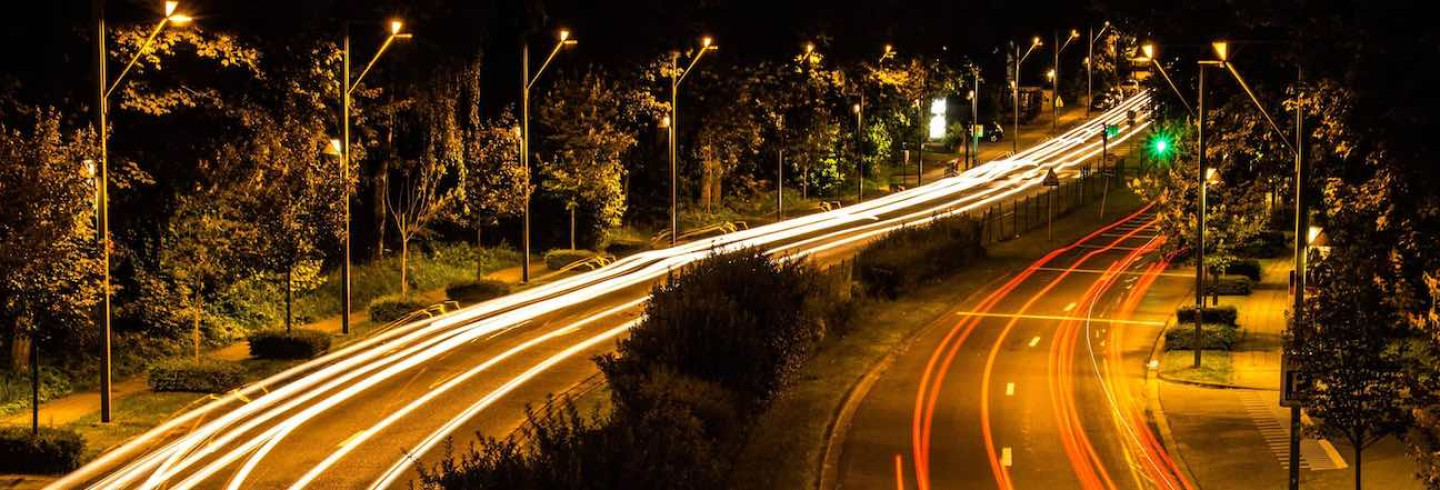 The long tail of legacy technology framed by light trails of cars on a hwy